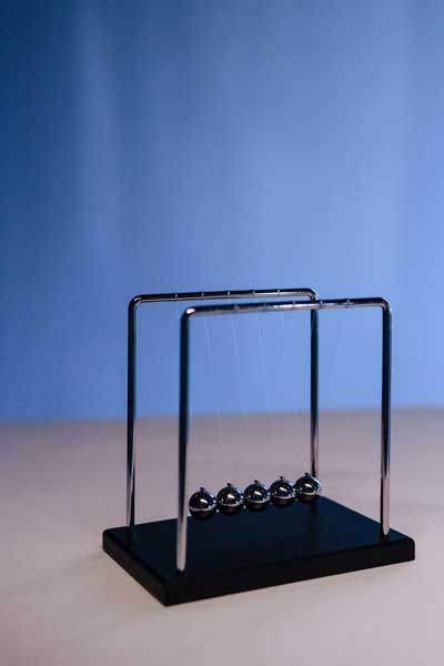 newton's cradle sitting on a table